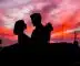 silhouette of man and woman facing each other during golden hour